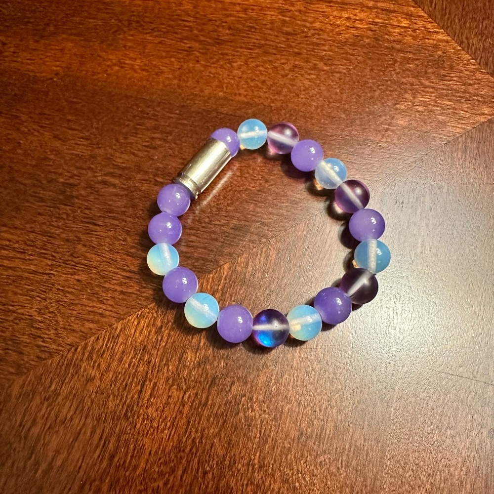 Purple and white silver bullet beaded bracelet.